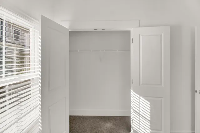 a view of a closet area with empty racks