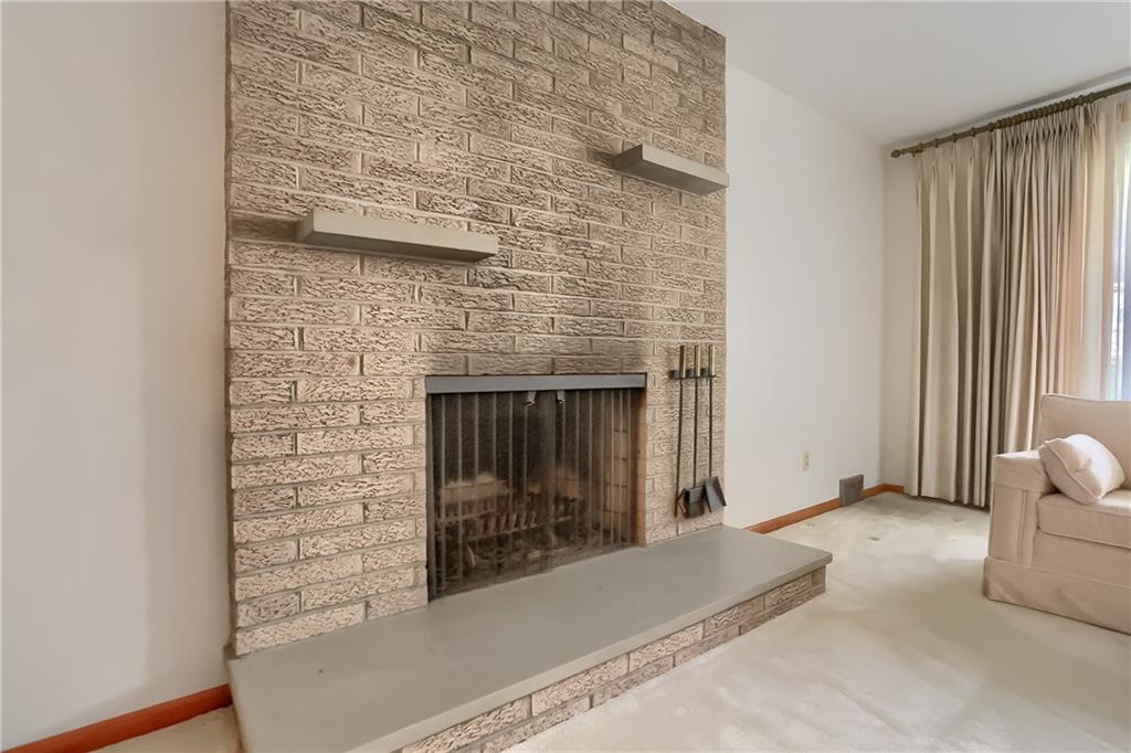 8893 Foxhunt Road Pittsburgh, PA 15237 - Photo 4 of 15 Beautiful brick fireplace located in the formal livingroom.