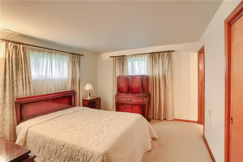 8893 Foxhunt Road Pittsburgh, PA 15237 - Photo 10 of 15 Master bedroom with ensuite. Plenty of natural light offered by the two windows.