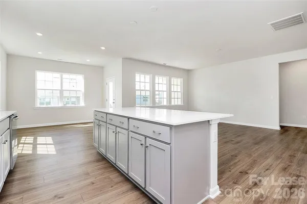 a large kitchen with a window