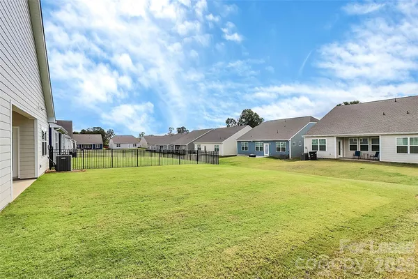 a front view of a house with a big yard