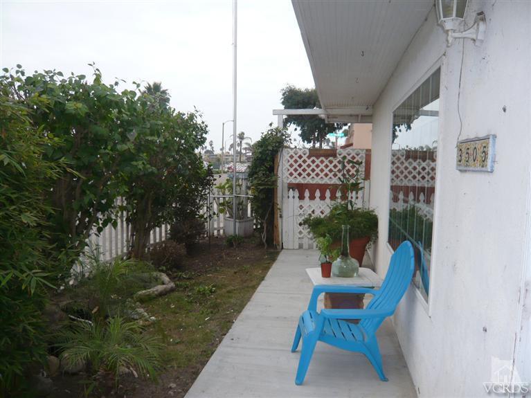 3505 Sunset Lane Oxnard, CA 93035 - Photo 13 of 21 a view of a patio with table and chairs and potted plants