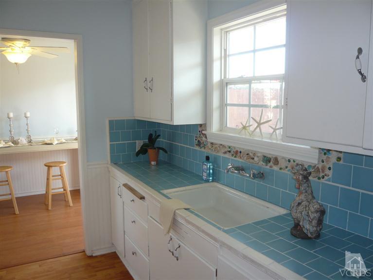 3505 Sunset Lane Oxnard, CA 93035 - Photo 8 of 21 a bathroom with a double vanity sink and a window