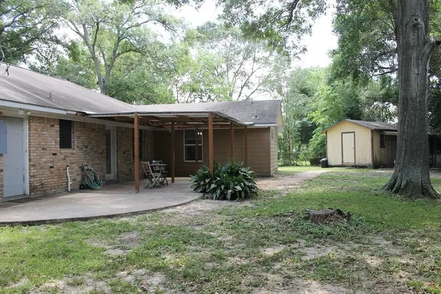 a front view of a house with a garden and porch