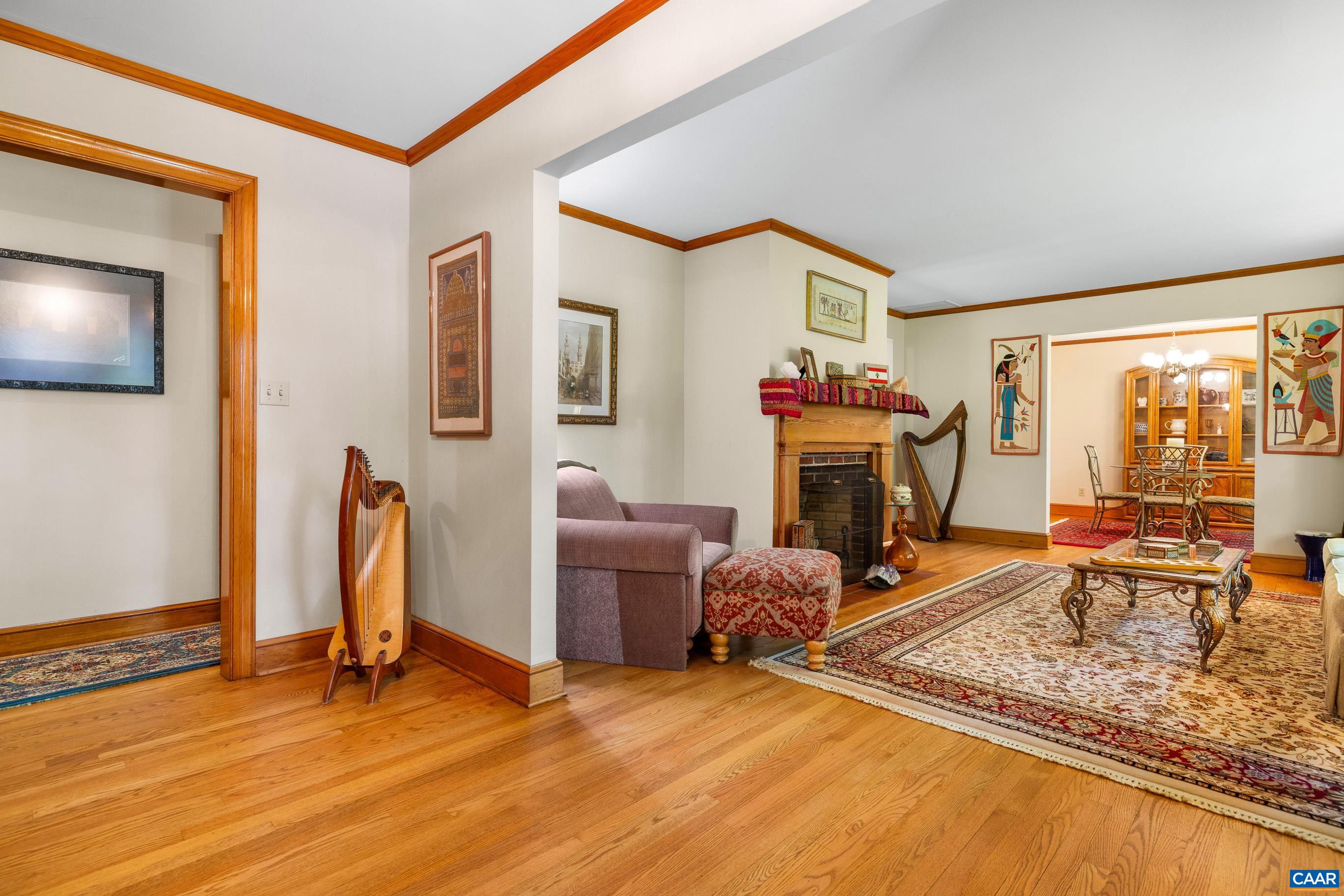 7250 Amicus Road Ruckersville, VA 22968 - Photo 24 of 74 a living room with furniture a flat screen tv and a fireplace