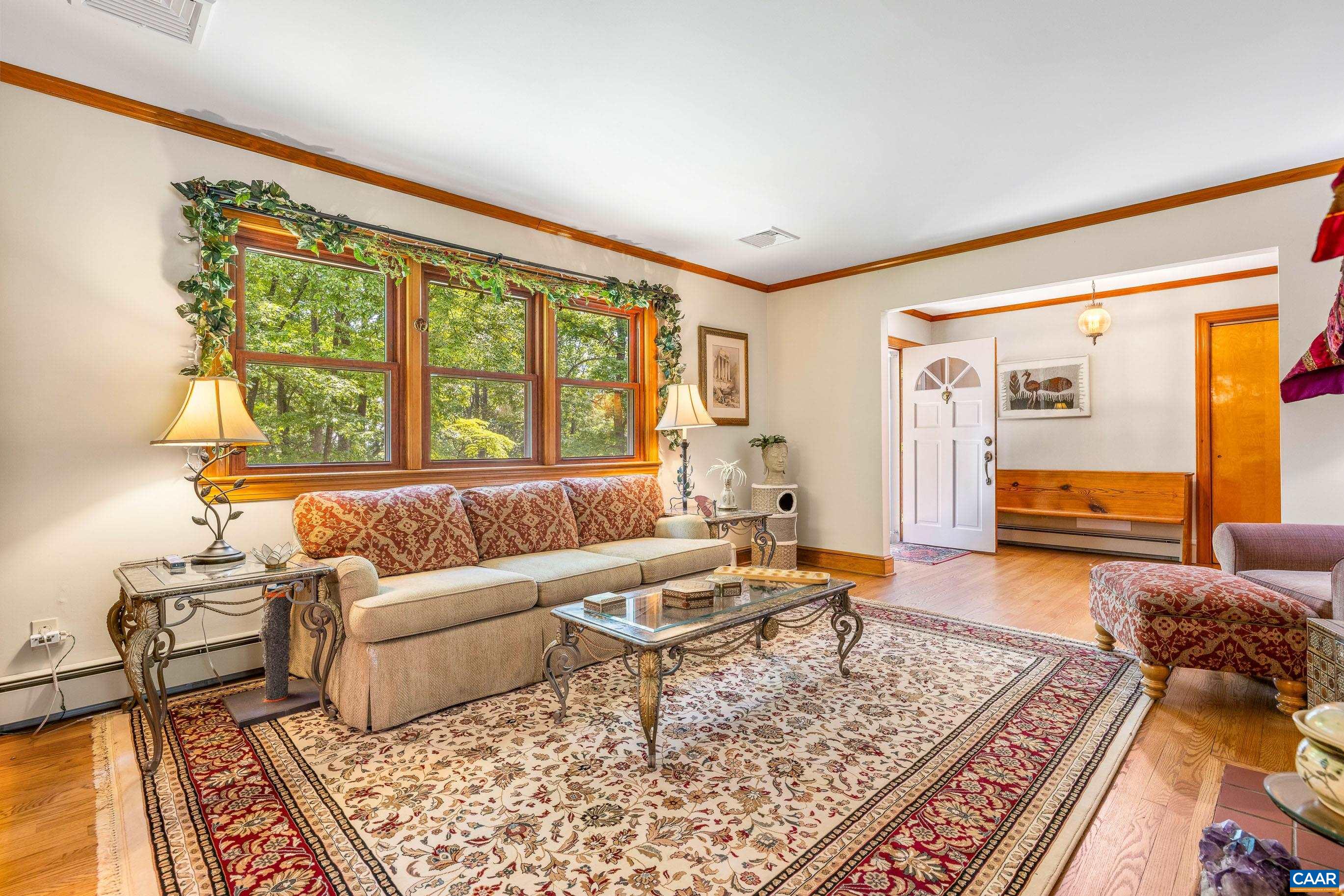 7250 Amicus Road Ruckersville, VA 22968 - Photo 26 of 74 a living room with furniture and a large window