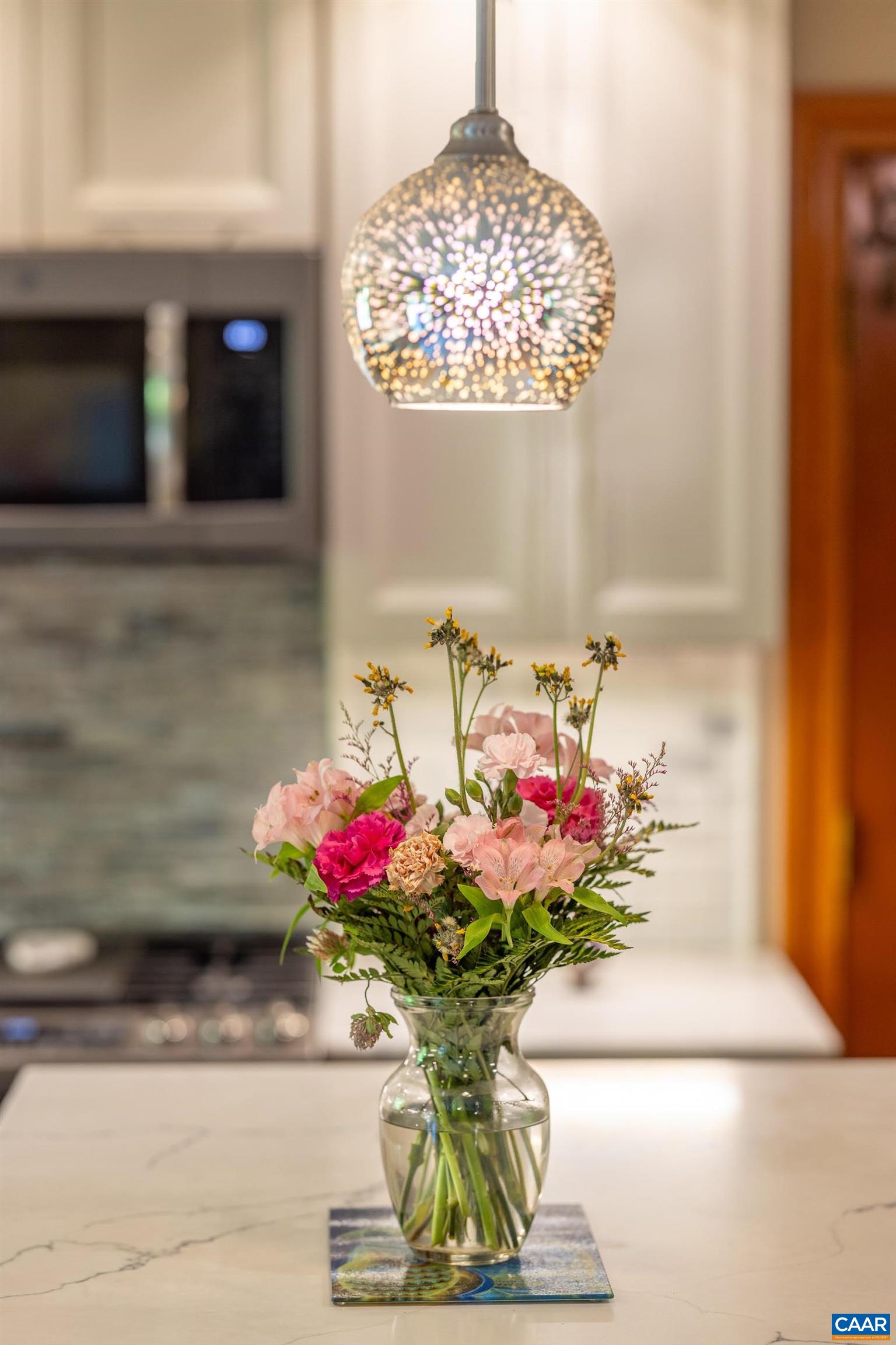 7250 Amicus Road Ruckersville, VA 22968 - Photo 32 of 74 a vase of flowers sitting on a floor