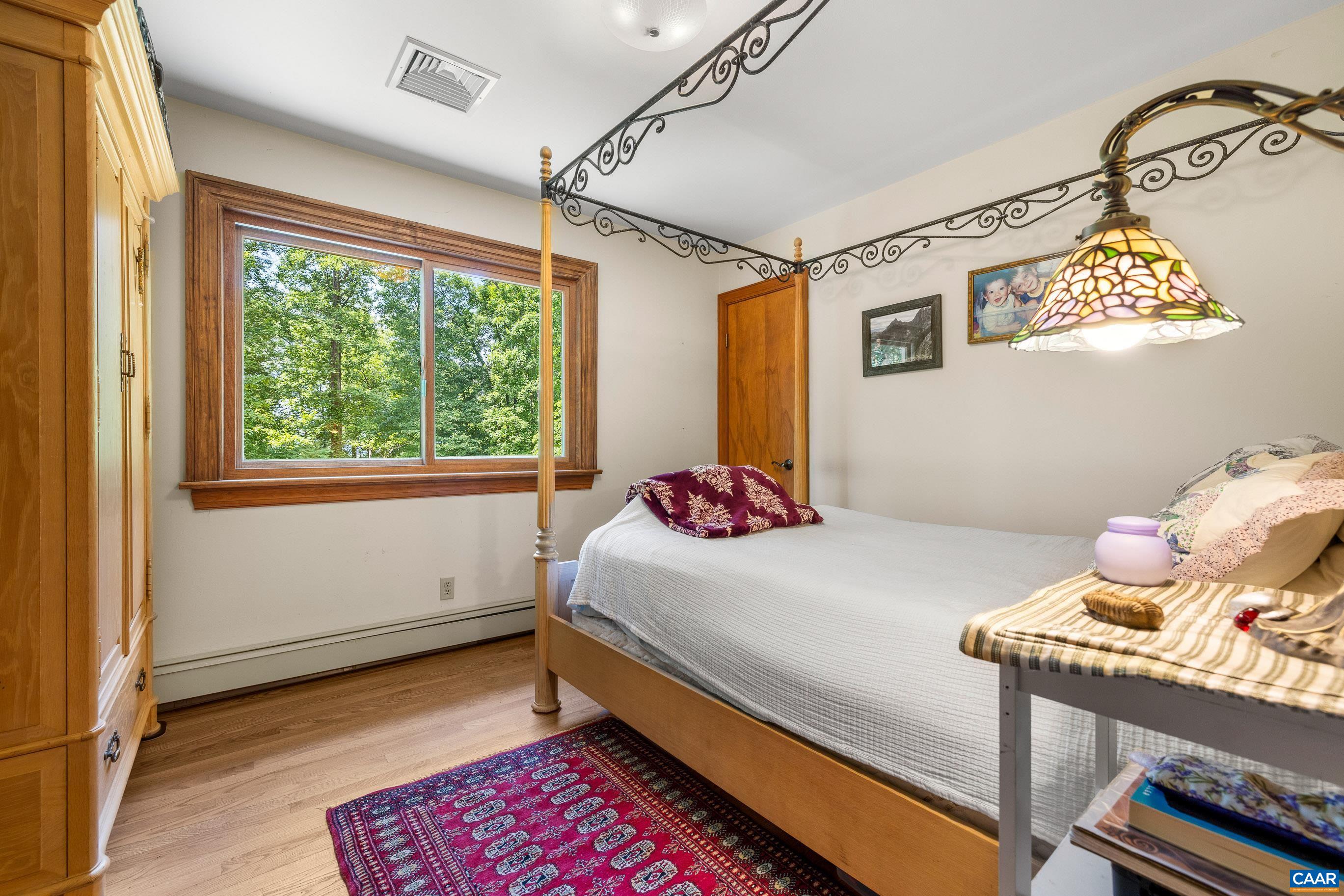 7250 Amicus Road Ruckersville, VA 22968 - Photo 42 of 74 a bedroom with a bed and a window