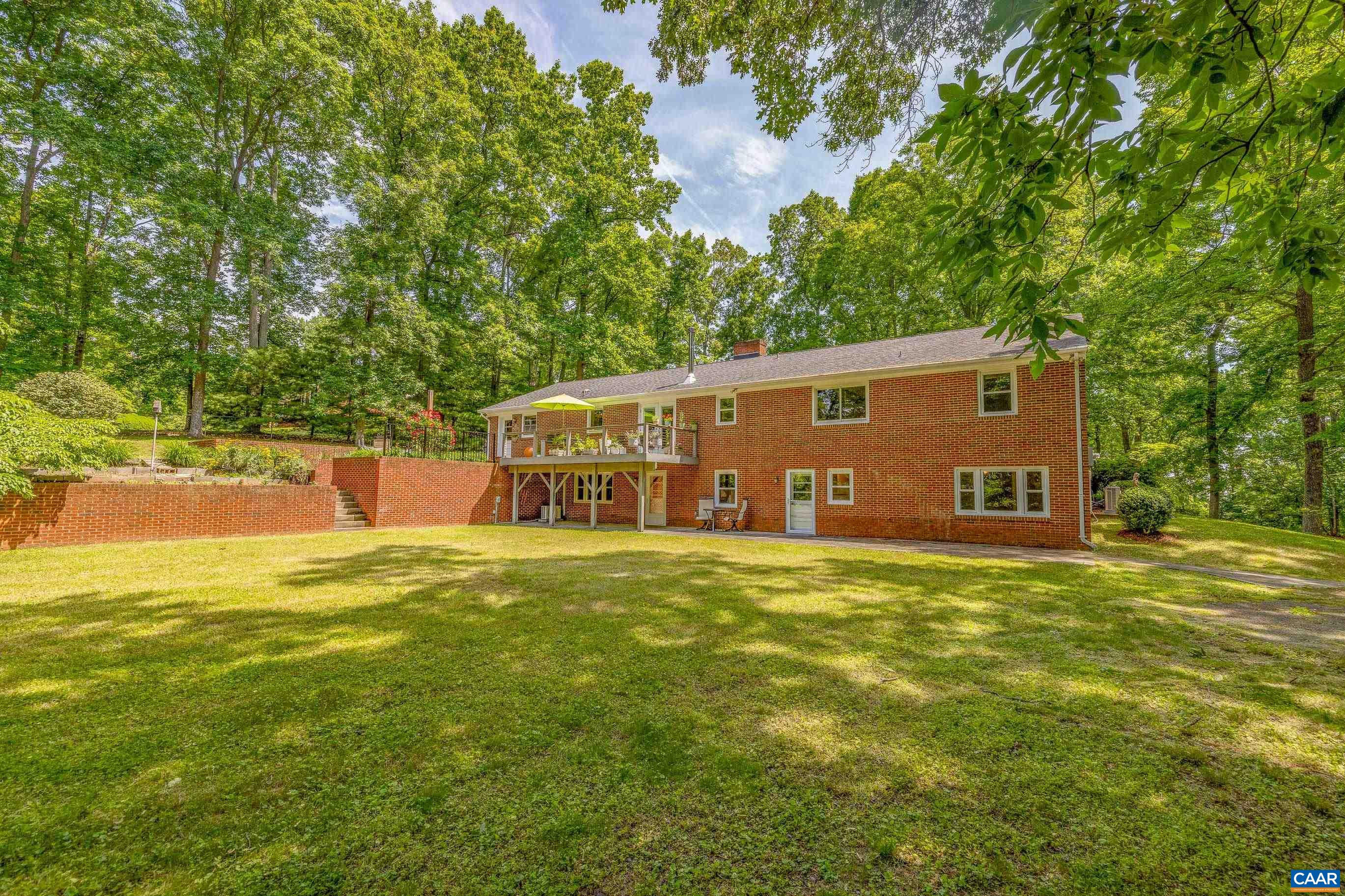 7250 Amicus Road Ruckersville, VA 22968 - Photo 5 of 74 a front view of a house with yard and trees