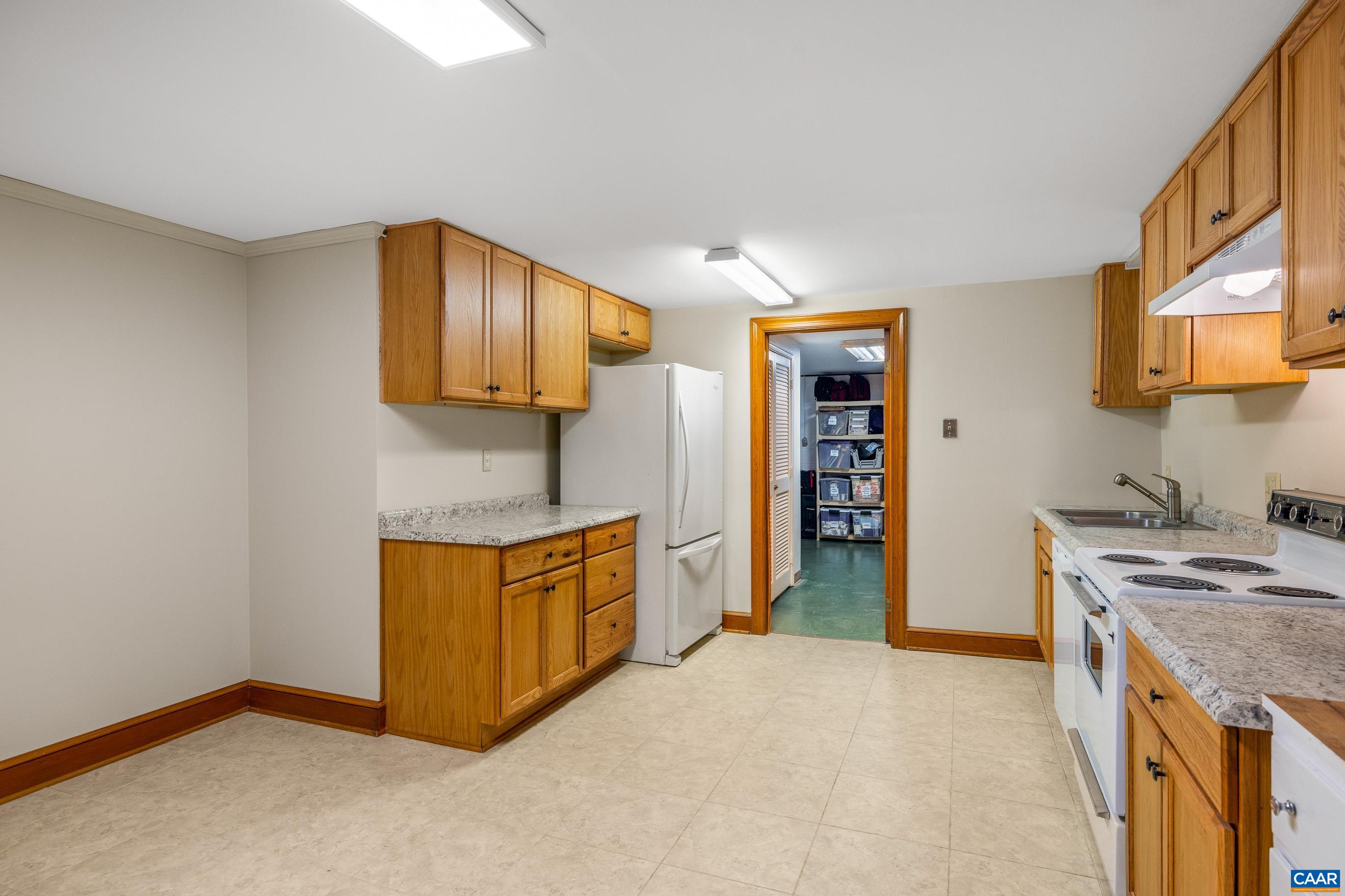 7250 Amicus Road Ruckersville, VA 22968 - Photo 53 of 74 a kitchen with stainless steel appliances granite countertop a stove a sink and a refrigerator