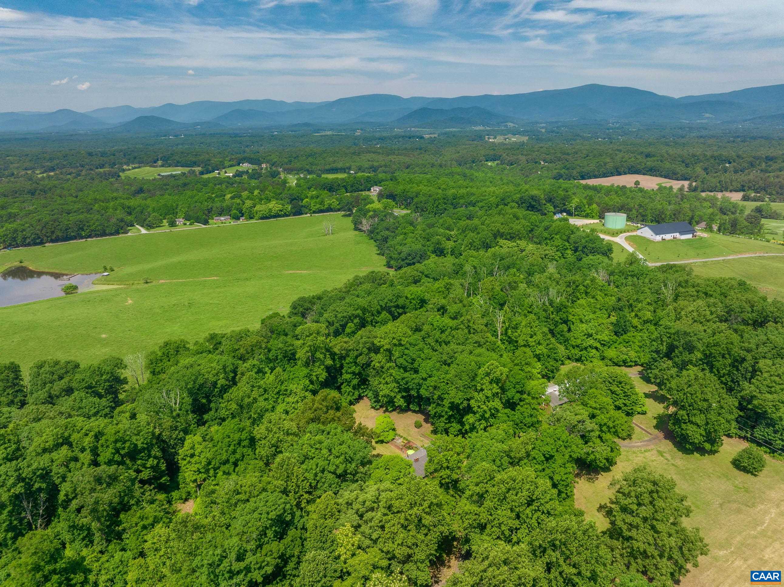 7250 Amicus Road Ruckersville, VA 22968 - Photo 72 of 74 a view of a lush green hillside and houses