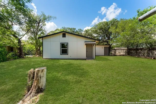 a house view with a garden space