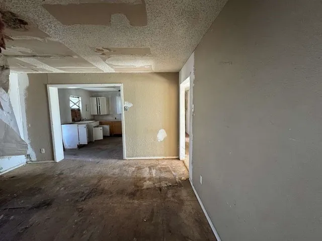 a view of a room with a sink and closet