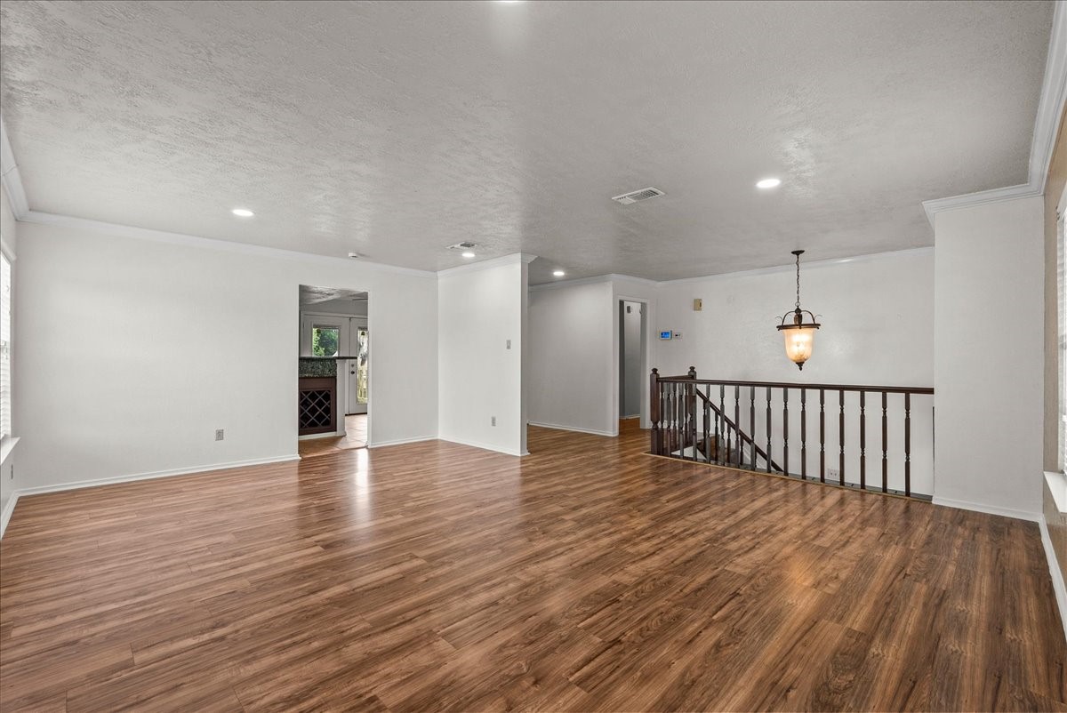 430 Redway Lane Houston, TX 77598 - Photo 16 of 43 a view of a hallway with wooden floor