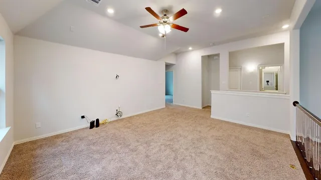a view of a livingroom with a ceiling fan