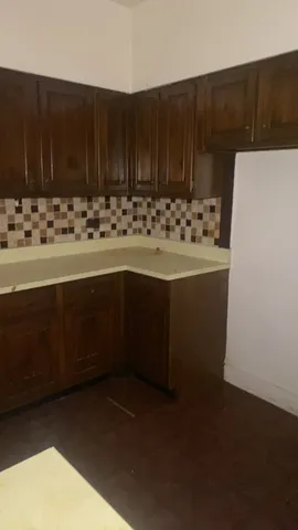 a kitchen with a sink and cabinets