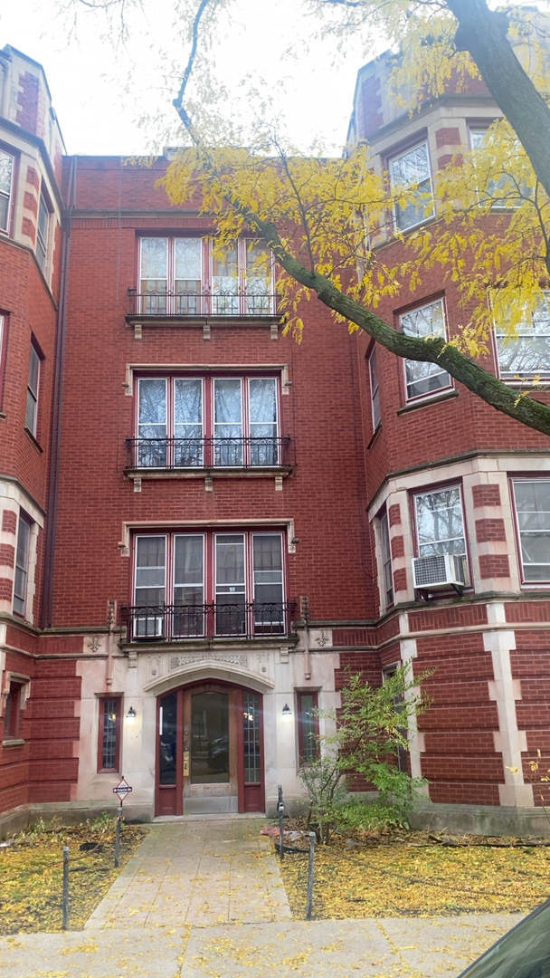 2233 East 70th Place, Unit 1 Chicago, IL 60649 - Photo 2 of 17 a front view of a building with windows