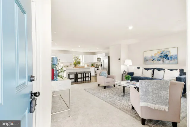 a living room with furniture and a table