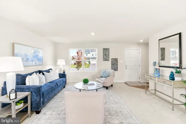 a kitchen with a sink and chairs