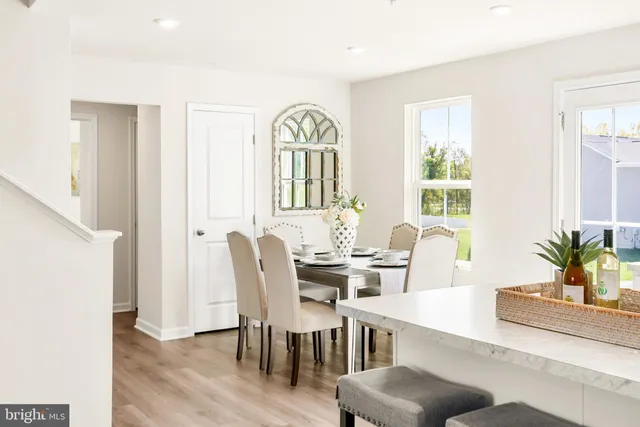 a view of living room with furniture and wooden floor