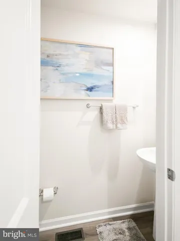 a bedroom with a bed and a lamp