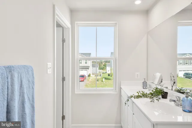 a view of a hallway with white walls