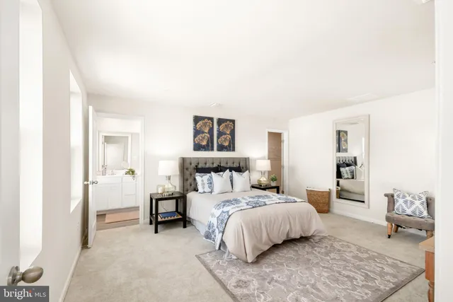 a bedroom with a bed and a couch