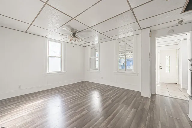 a view of a livingroom with wooden floor