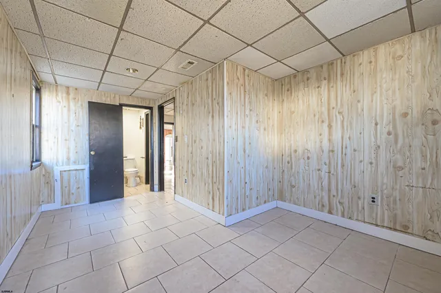 a bathroom with a shower and a sink