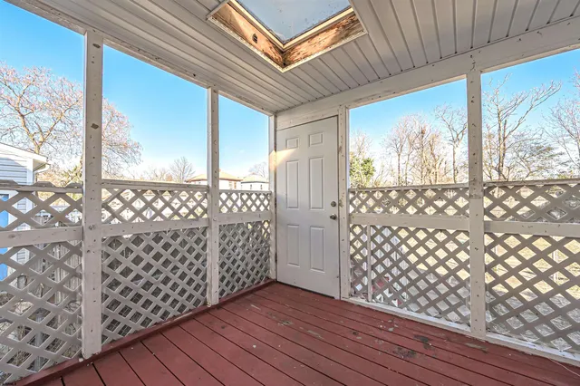 a view of a house with wooden deck