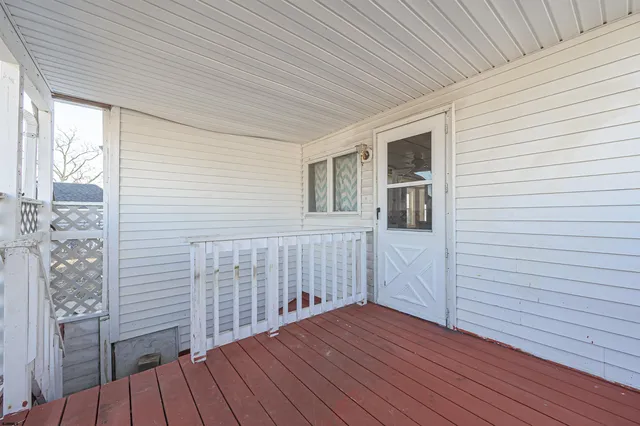 a view of house with wooden fence