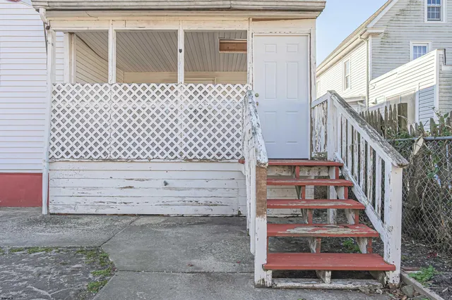 a view of a house with a snow in the yard