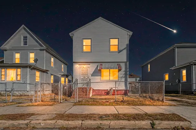 a view of a kitchen with a sink and cabinets