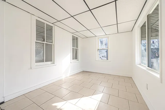 a view of empty room with windows