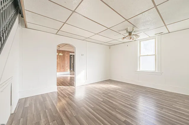 a view of a room with wooden floor