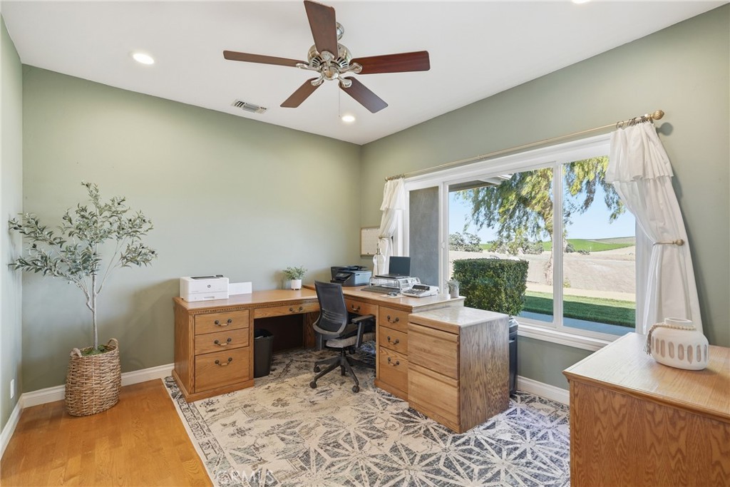 220 Cook Court Templeton, CA 93465 - Photo 17 of 45 a view of a workspace with furniture and a potted plant