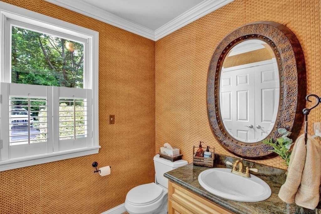171 Scotland Road Newbury, MA 01951 - Photo 4 of 20 a bathroom with a sink a mirror a toilet and a window