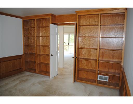 Den. Built-in bookcases in Den