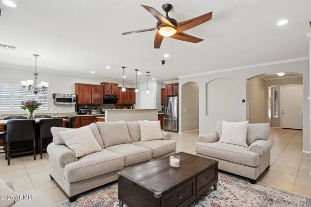 a kitchen with stainless steel appliances granite countertop a refrigerator stove and sink