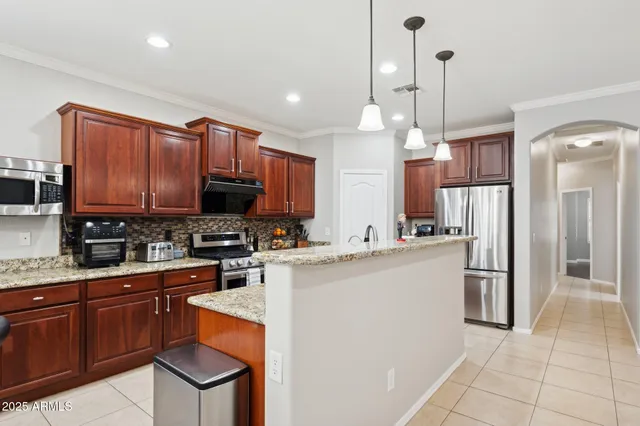a view of a dining room with furniture and window