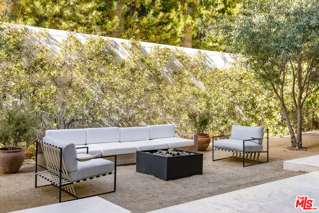 755 Sarbonne Road Los Angeles, CA 90077 - Photo 12 of 24 a backyard of a house with outdoor seating