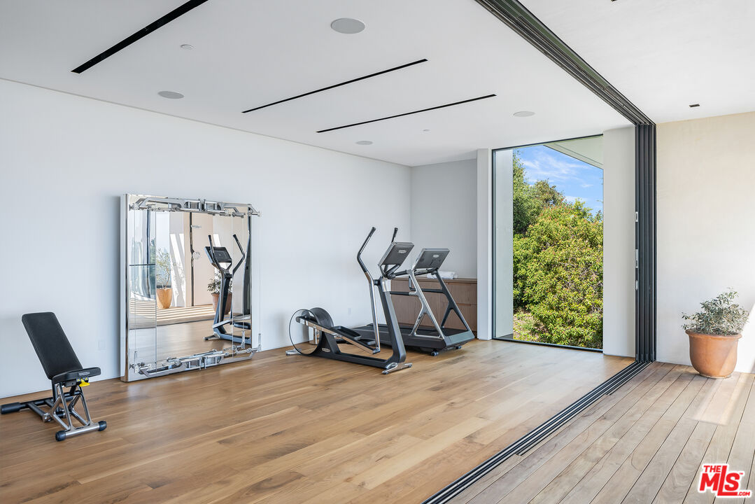 755 Sarbonne Road Los Angeles, CA 90077 - Photo 19 of 24 a view of a room with gym equipment