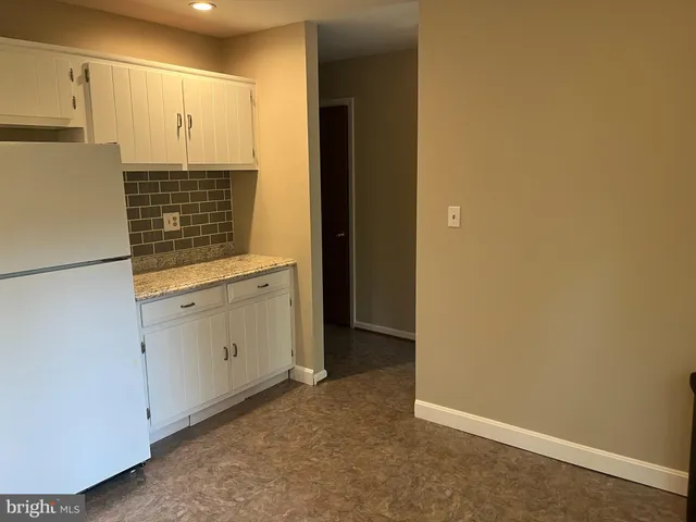 a view of cabinets and wooden floor