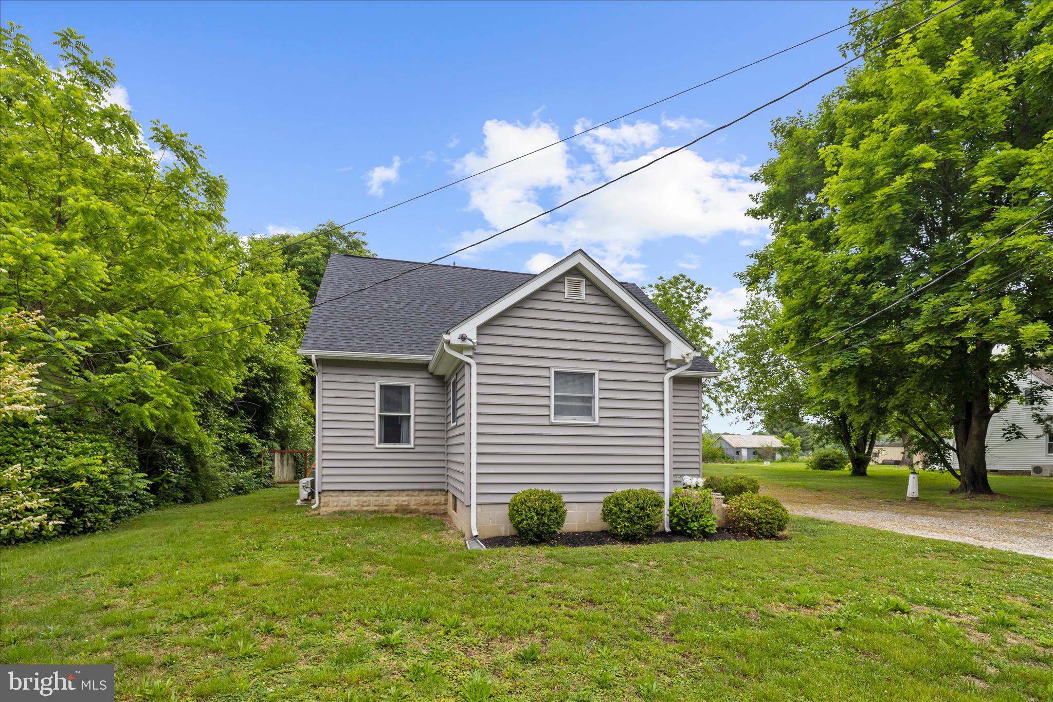 11994 Cordova Road Cordova, MD 21625 - Photo 4 of 57 a front view of a house with a yard