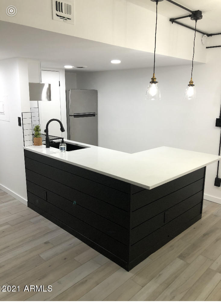 3416 North 44th Street, Unit 34 Phoenix, AZ 85018 - Photo 13 of 41 a room with a sink and a mirror