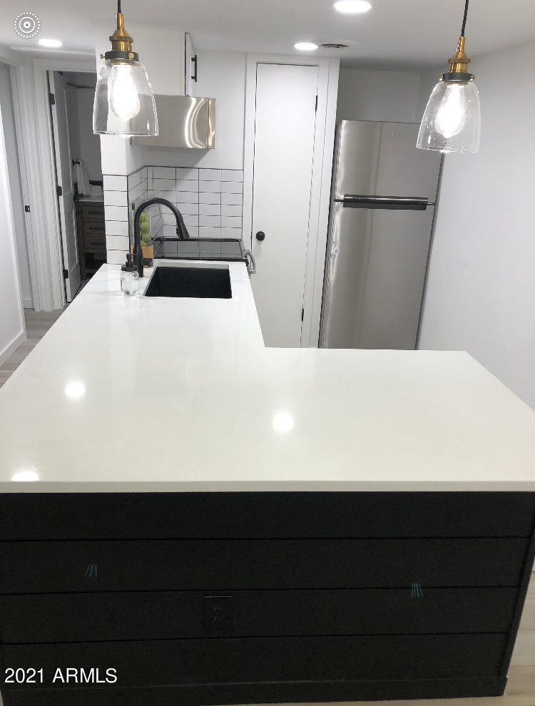3416 North 44th Street, Unit 34 Phoenix, AZ 85018 - Photo 14 of 41 a bathroom with a sink and a mirror