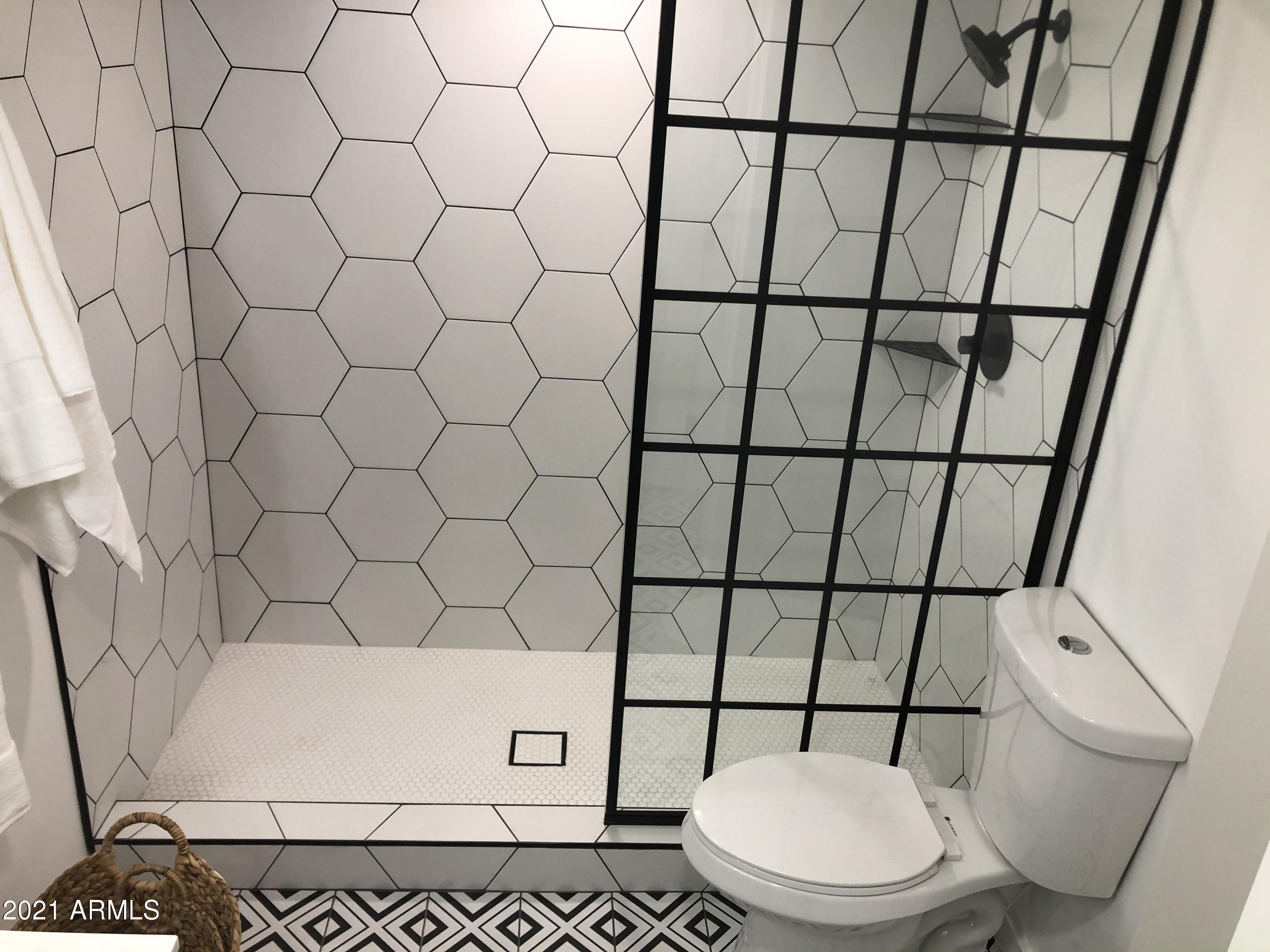 3416 North 44th Street, Unit 34 Phoenix, AZ 85018 - Photo 19 of 41 a white toilet sitting next to a white wall