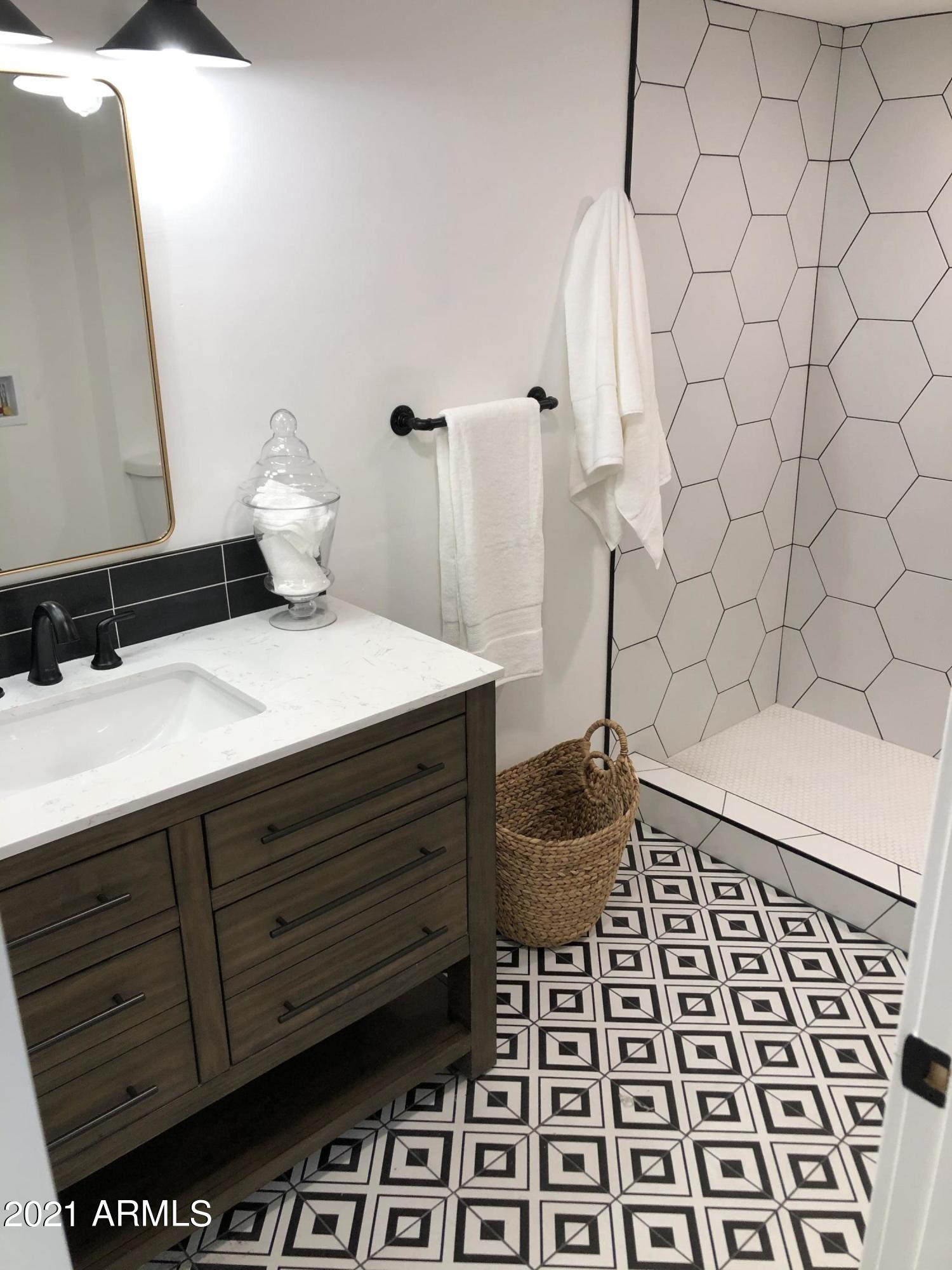 3416 North 44th Street, Unit 34 Phoenix, AZ 85018 - Photo 24 of 41 a bathroom with a sink and a mirror