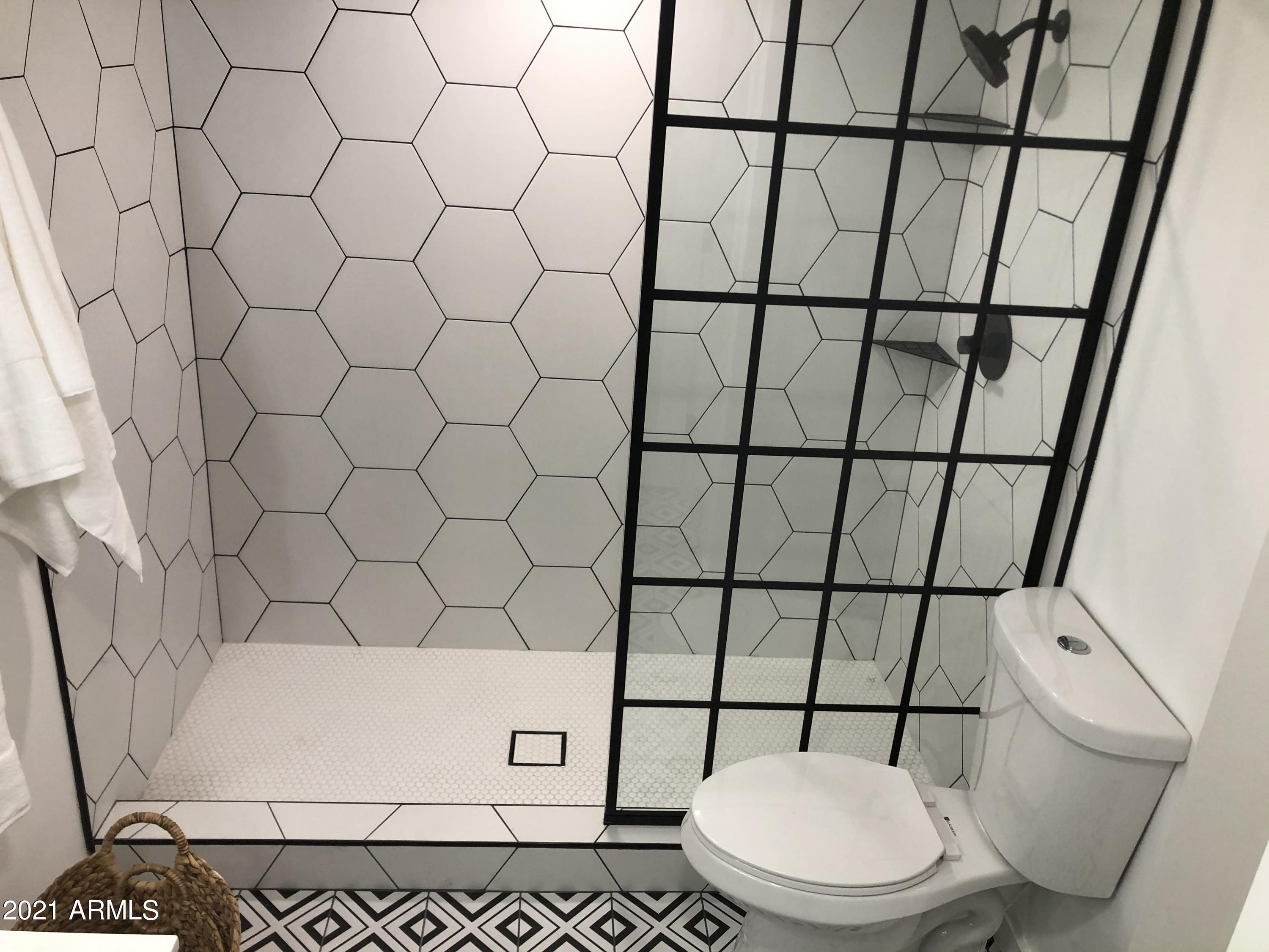 3416 North 44th Street, Unit 34 Phoenix, AZ 85018 - Photo 25 of 41 a white toilet sitting next to a white wall