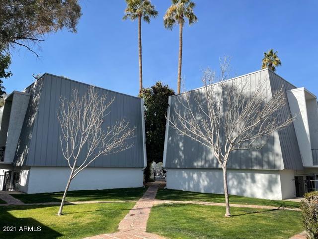3416 North 44th Street, Unit 34 Phoenix, AZ 85018 - Photo 28 of 41 a view of a backyard with a small pool
